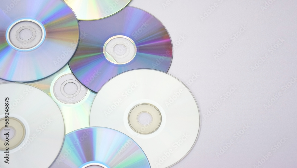 Lots of old CDs are laid out as a background. Lots of old CDs are laid out as a background.