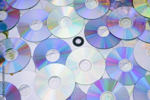 Lots of old CDs are laid out as a background. #569245849