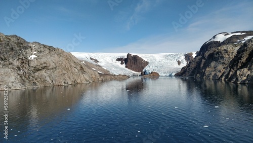 Melting glacier in Greenland exposes rocky parts of the coastline for the first time in years