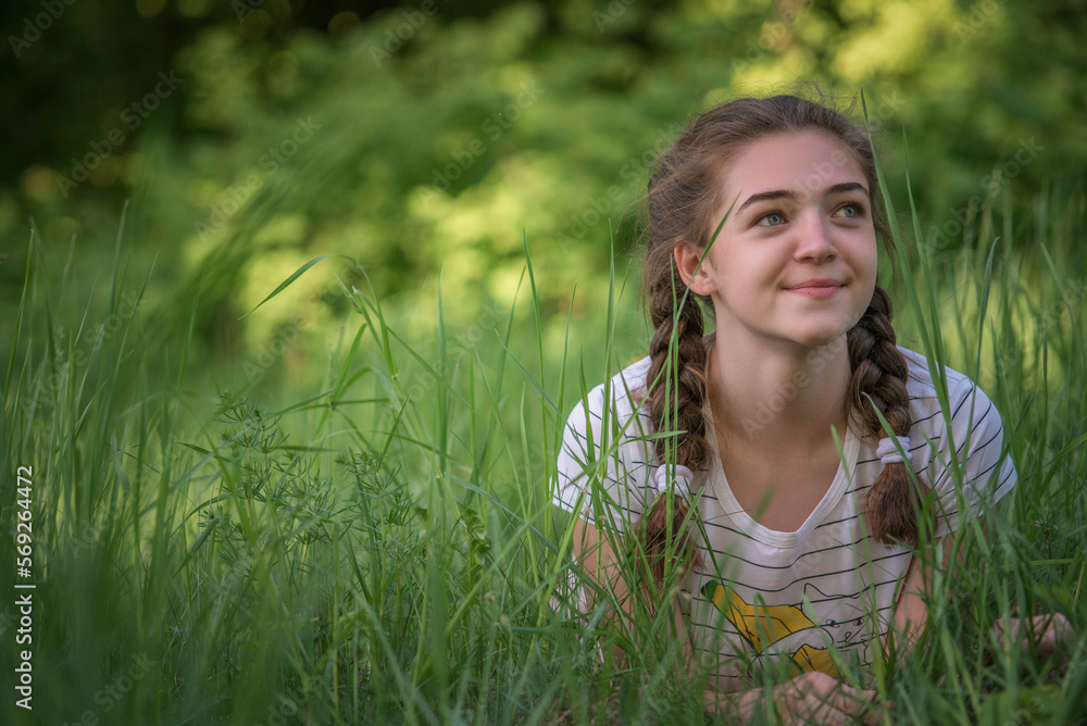 Portrait of a young beautiful long-haired girl on a summer day. Portrait of a young beautiful long-haired girl on a summer day.