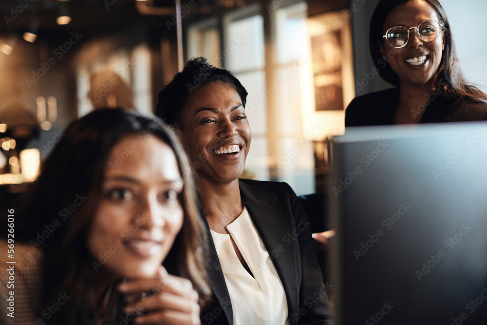 Happy female entrepreneurs laughing at office Happy female entrepreneurs laughing at office
