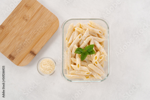 Batch cooking pasta with cream and cheese. Linch box, ready to eat. Preparation meal, zero waste. photo