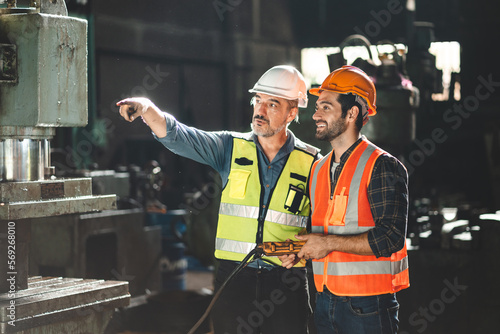 Senior male engineer traini...