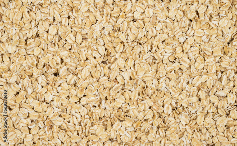 Dry oat flakes scattered randomly. Top view. Dry oat flakes scattered randomly. Top view.