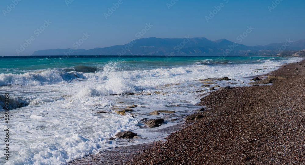 East shore of Rhodes Island with big waves and rocky beach East shore of Rhodes Island with big waves and rocky beach