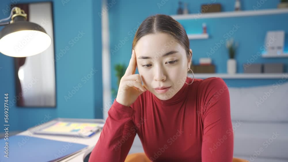 Frustrated young Asian woman looking at laptop unhappy.
Asian woman sitting alone at home looking at laptop screen frustrated and unhappy.
Frustrated young Asian woman looking at laptop unhappy.
Asian woman sitting alone at home looking at laptop screen frustrated and unhappy.