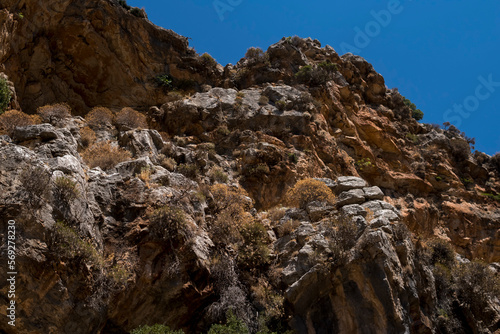 Cave on steep slope of a mountains at Rhodes Island