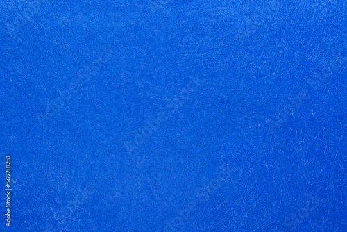 Texture of a sheet of dark blue felt for needlework