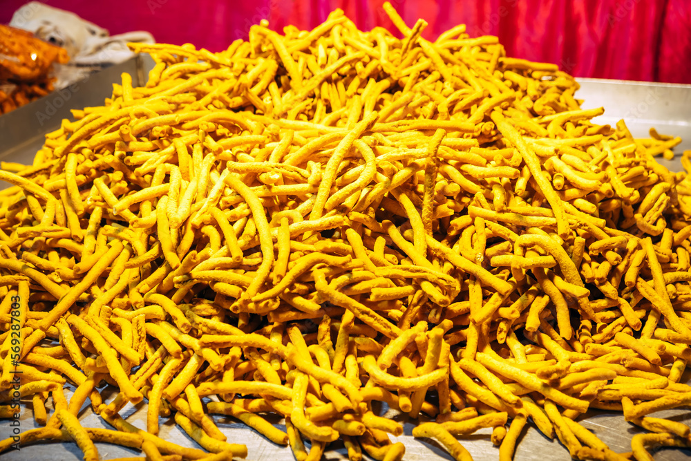 Sev and Til (Sesame seeds) revdi, rewri, rewadi, revadi, revri. A bunch of popular Indian sweets at the night market near the temple. Sweet Indian background Sev and Til (Sesame seeds) revdi, rewri, rewadi, revadi, revri. A bunch of popular Indian sweets at the night market near the temple. Sweet Indian background