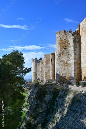 View of the outer walls of an imposing medieval castle of Lucera. It is located in Puglia in the province of Foggia, Italy. photo