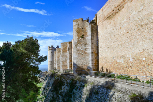 View of the outer walls of an imposing medieval castle of Lucera. It is located in Puglia in the province of Foggia, Italy.