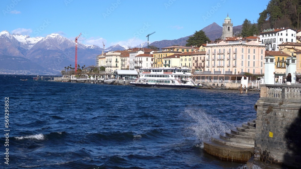Europe, Lombardy , Bellagio, The Pearl of Lake Como,  is a amazing village  with colored houses - strong gusts of wind that create waves  for surfing in the waters of the lake - increase level lake 