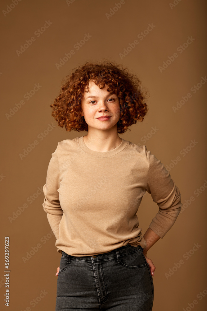 Portrait of a cute ginger girl with curly hair. Portrait of a cute ginger girl with curly hair.