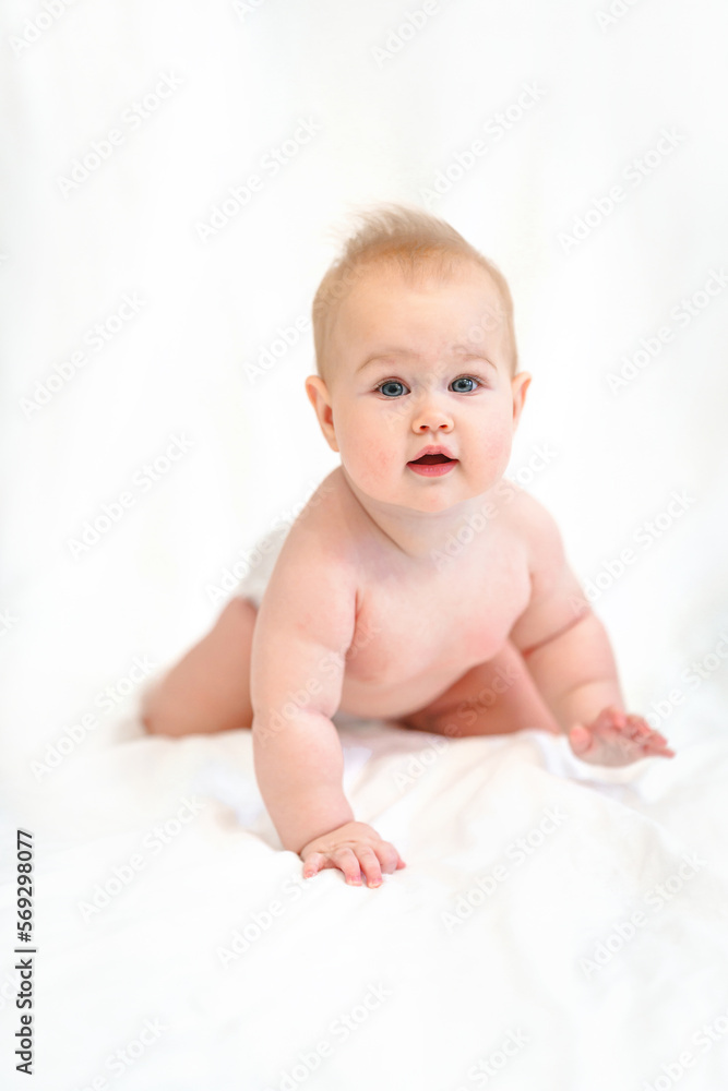 Beautiful Little Caucasian baby in a diaper on a white background Beautiful Little Caucasian baby in a diaper on a white background