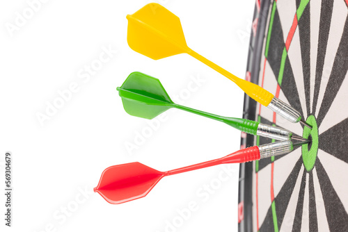 Three multi-colored darts hit the center of the target.