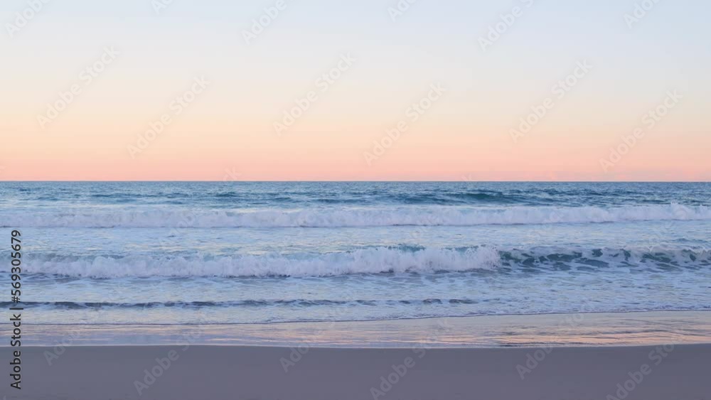 Panoramic view of lonely beach at sunset with waves and reflections in 4k Panoramic view of lonely beach at sunset with waves and reflections in 4k