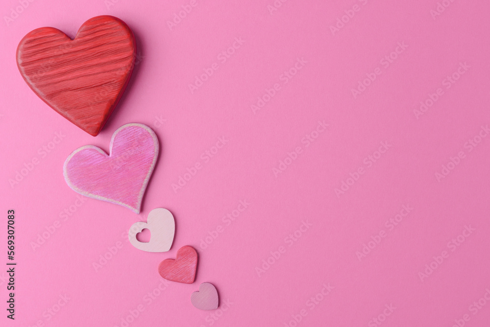 Various valentine’s hearts on pink background with copy space. Valentine’s Day creative greeting card template