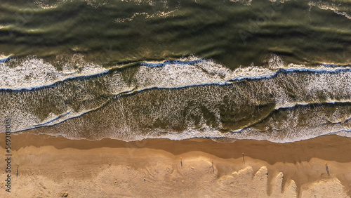 sea with waves and sand from above