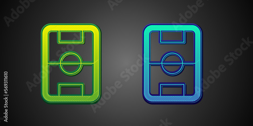 Green and blue Football or soccer field icon isolated on black background. Vector