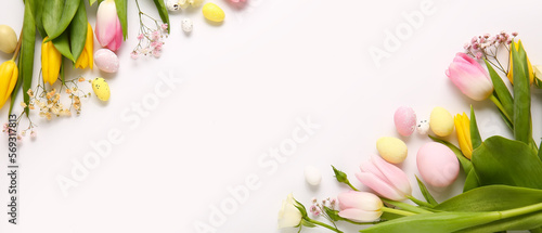 Fototapeta Naklejka Na Ścianę i Meble -  Beautiful flowers and Easter eggs on light background with space for text