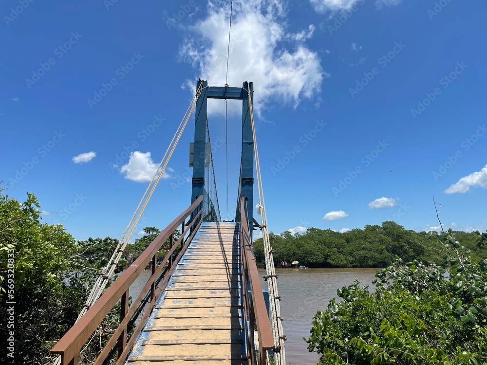 a bridge over the river and a blue sky on a peaceful sunny summer day a bridge over the river and a blue sky on a peaceful sunny summer day
