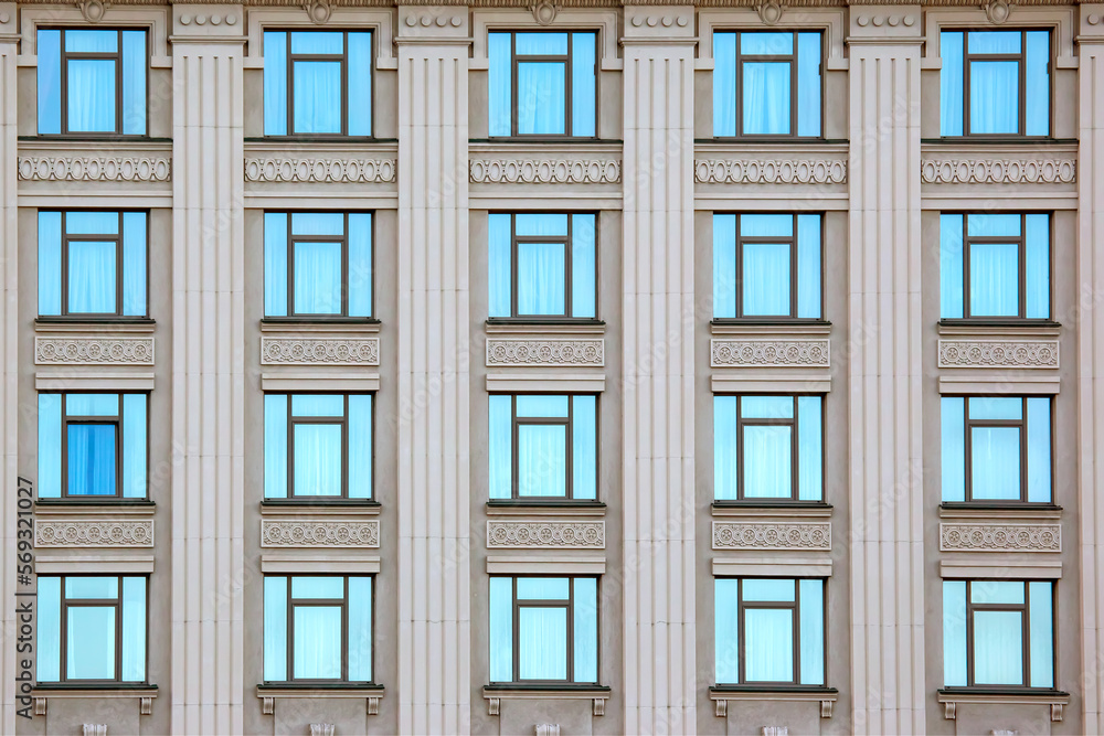 Obraz premium building facade with windows. residential building industry in the city