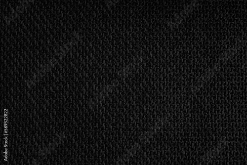 Closeup to a black cloth fabric textured sample 