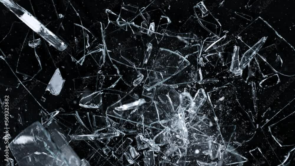 Super Slow Motion Shot of Falling and Shattering Glass Shards Isolated on Black at 1000fps. Super Slow Motion Shot of Falling and Shattering Glass Shards Isolated on Black at 1000fps.