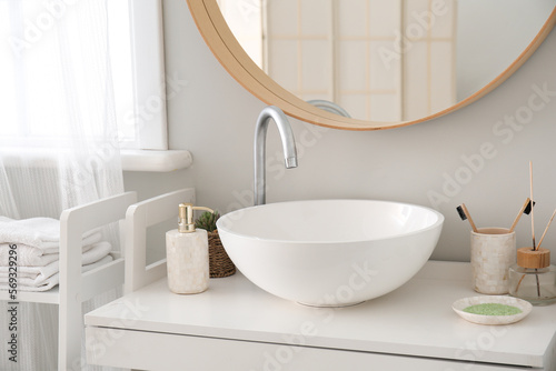 Interior of bathroom with sink  mirror and bath accessories