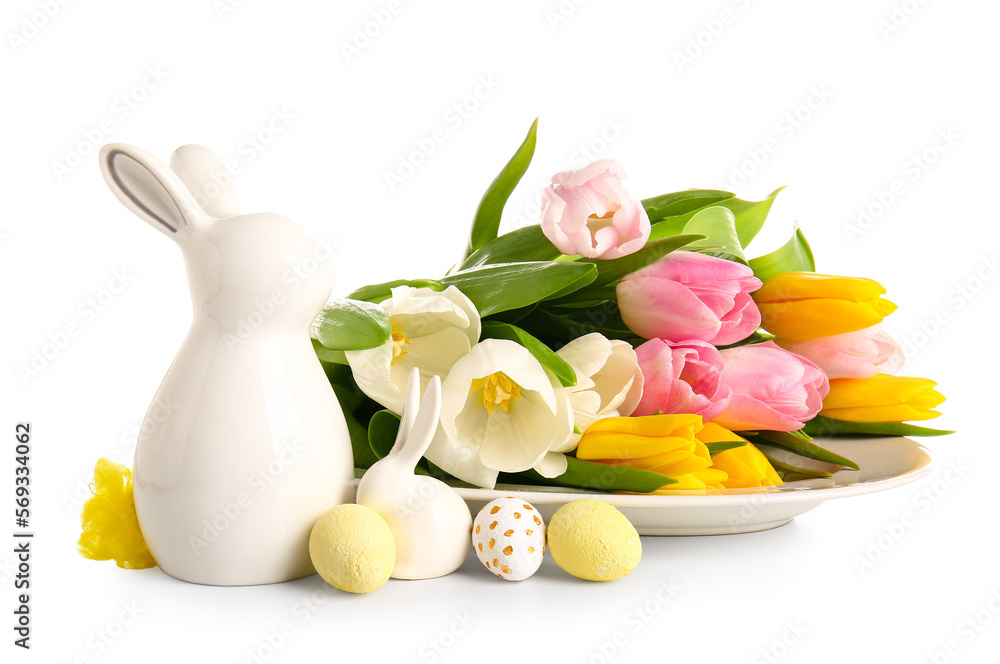 Plate with beautiful tulip flowers, Easter eggs and ceramic bunny on white background