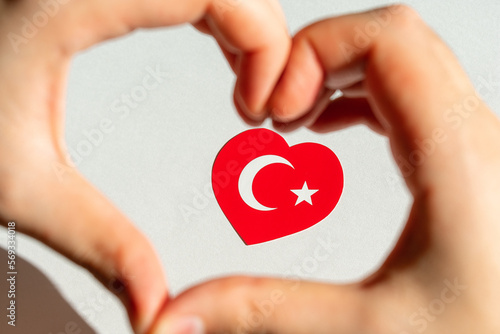 Turkish flag in the form of a heart inside a heart from the hands