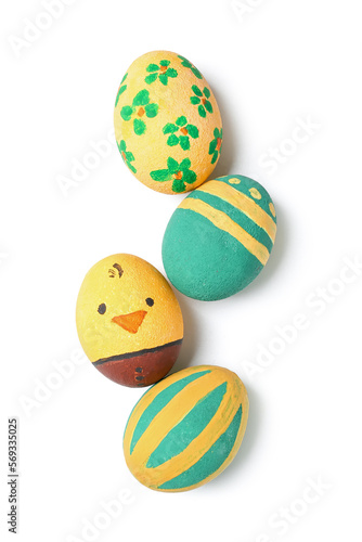 Painted Easter eggs on white background, top view