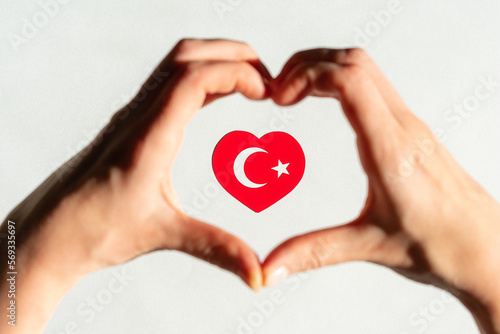 Turkish flag in the form of a heart inside a heart from the hands