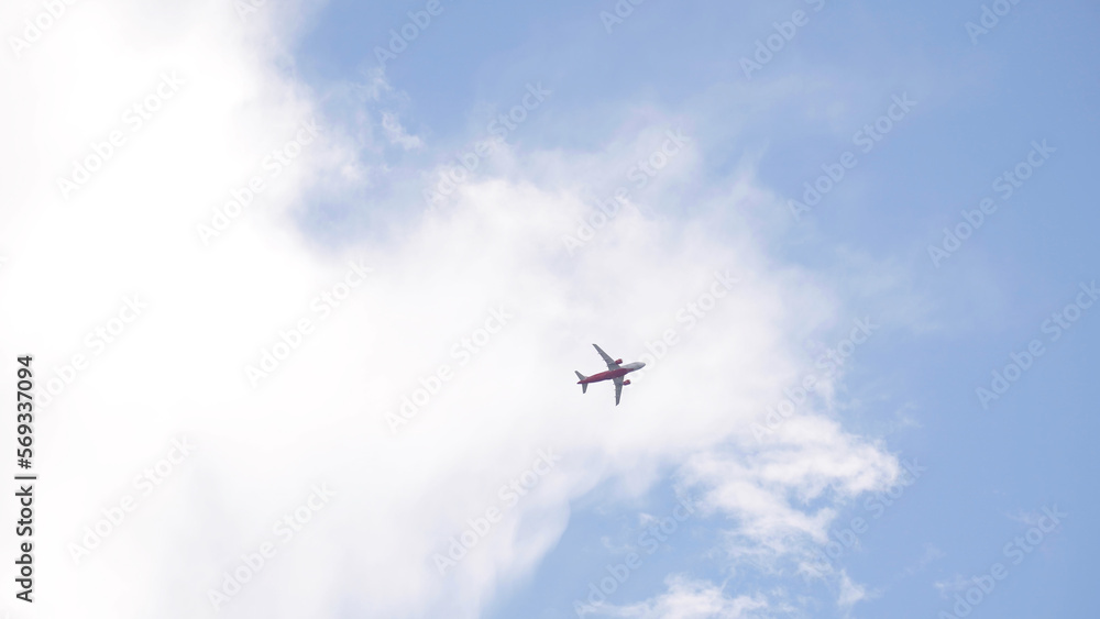 The plane is landing against the background of the evening blue sky. The plane is landing against the background of the evening blue sky.