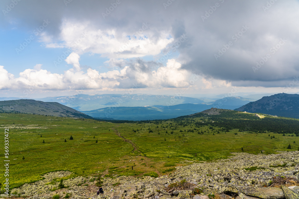 Forests and mountains of the Southern Urals near the village of Tyulyuk in Russia. Drone view. Forests and mountains of the Southern Urals near the village of Tyulyuk in Russia. Drone view.