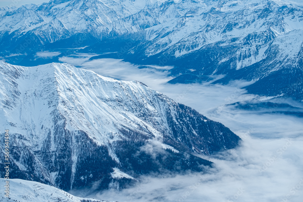 Obraz premium Mountains covered with snow and clouds. The mountains are the Italian Alps