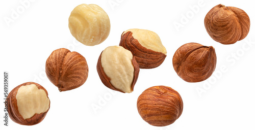 Falling hazelnuts isolated on white background