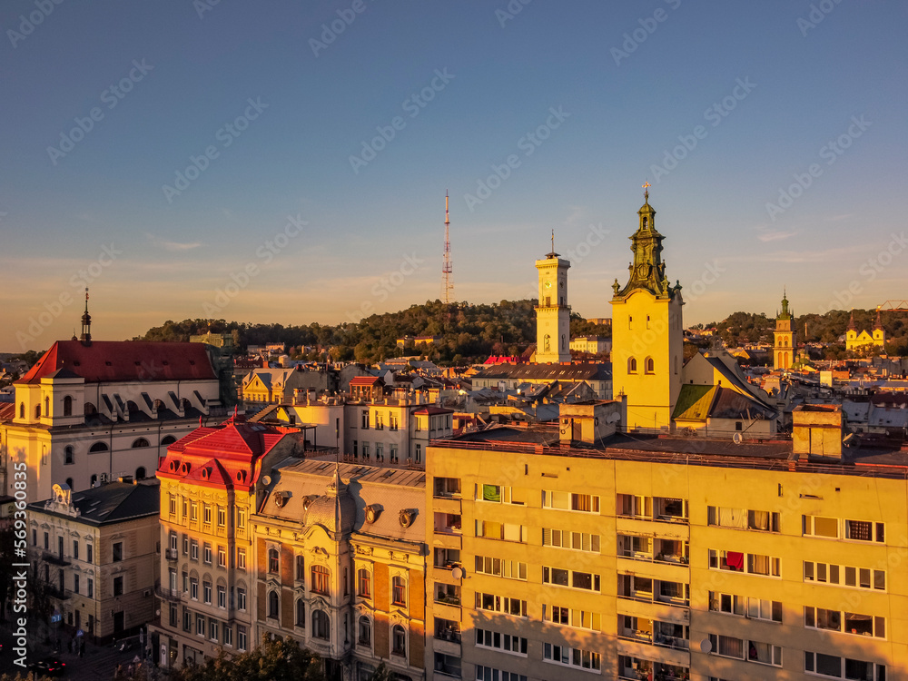 Naklejka premium Aerial view of architecture of Lviv by drone. Summer Ukraine Lviv region, West Ukraine. Sunset.