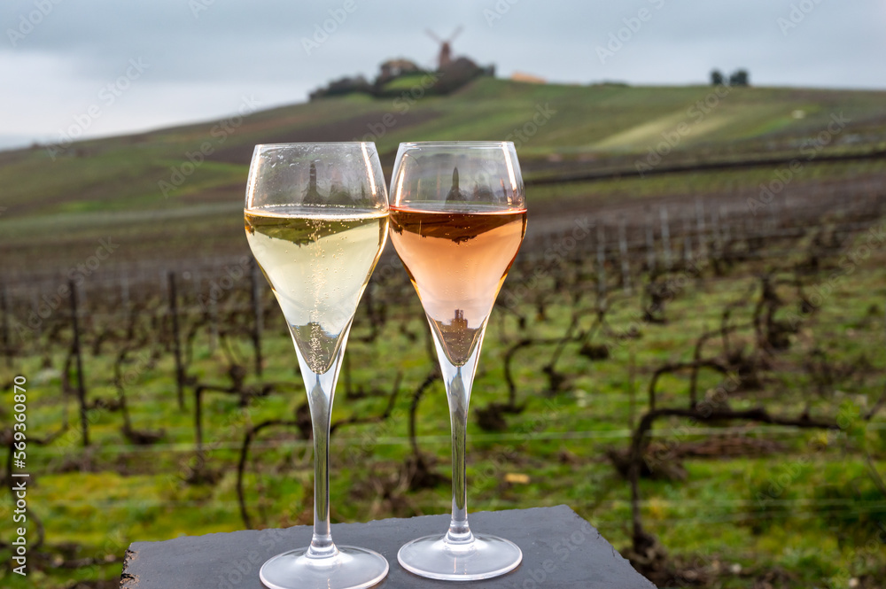 Tasting of brut and rose champagne sparkling wine outdoor with view on pinot noir gran cru vineyards of famous champagne houses in Montagne de Reims near Verzenay, Champagne, France Tasting of brut and rose champagne sparkling wine outdoor with view on pinot noir gran cru vineyards of famous champagne houses in Montagne de Reims near Verzenay, Champagne, France