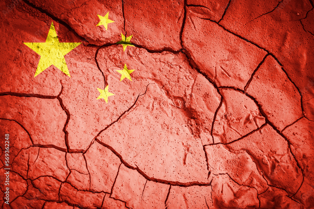 Flag of China. china symbol. Flag on the background of dry cracked earth. Chinese flag with drought concept Flag of China. china symbol. Flag on the background of dry cracked earth. Chinese flag with drought concept