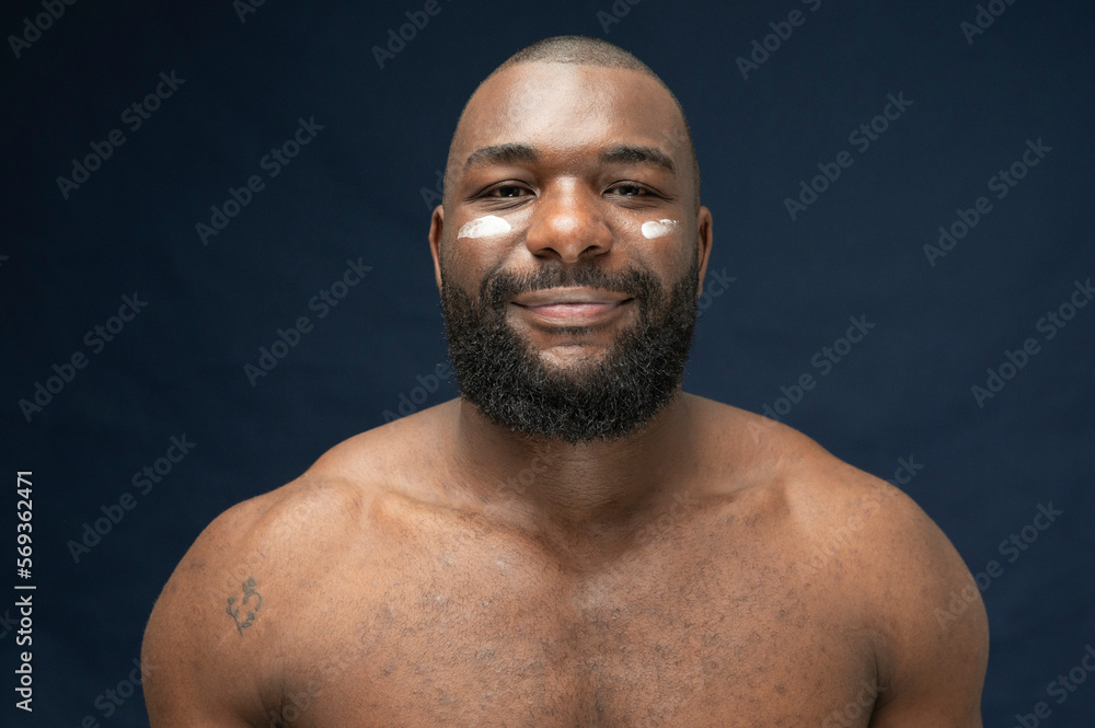 Fototapeta premium Muscular African Handsome bearded Skincare Smiling