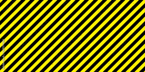 Textured caution tape seamless pattern. Yellow and black diagonal stripes repeated background. Danger warning wallpaper. Vector