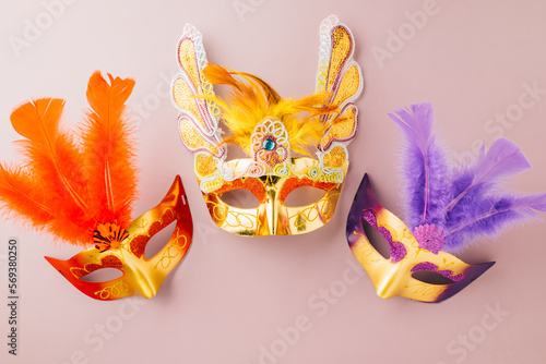 Venetian mask, Carnival mask for Mardi Gras celebration isolated on purple background banner design with copy space, jewish holiday, Purim in Hebrew holiday carnival ball, Happy Purim carnival concept photo