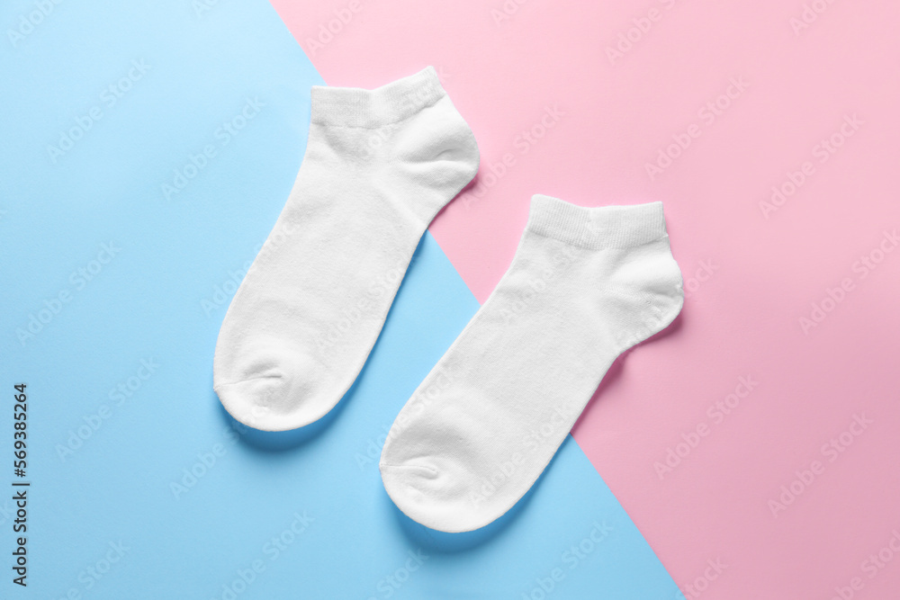 Pair of white socks on colorful background, flat lay Pair of white socks on colorful background, flat lay