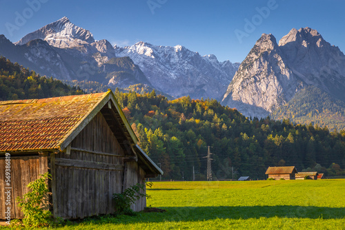 Bavarian alps and rustic farm barn, Garmisch, Zugspitze massif, Bavaria, Germany