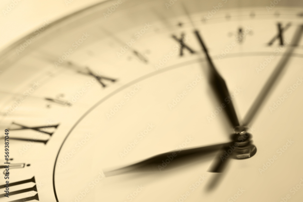 Fototapeta premium Fleeting time concept. Clock on light background, closeup. Motion effect