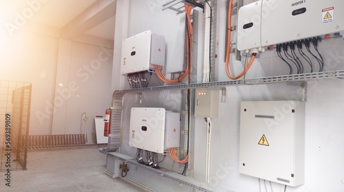 Instalation control of inverters solar panel on the wall. Technology of solar energy with shiny light.