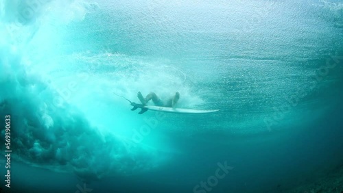 Slow Motion Shot Of Male Surfer Falling While Surfing Undersea During Vacation - Thulusdhoo, Maldives photo