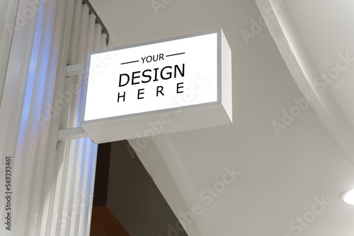 White signage mockup on a wall. Mockup sign outside of a shop. White Square Sign With Blank Space