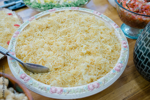 buffet with chicken sausage, mashed potatoes and straw potatoes